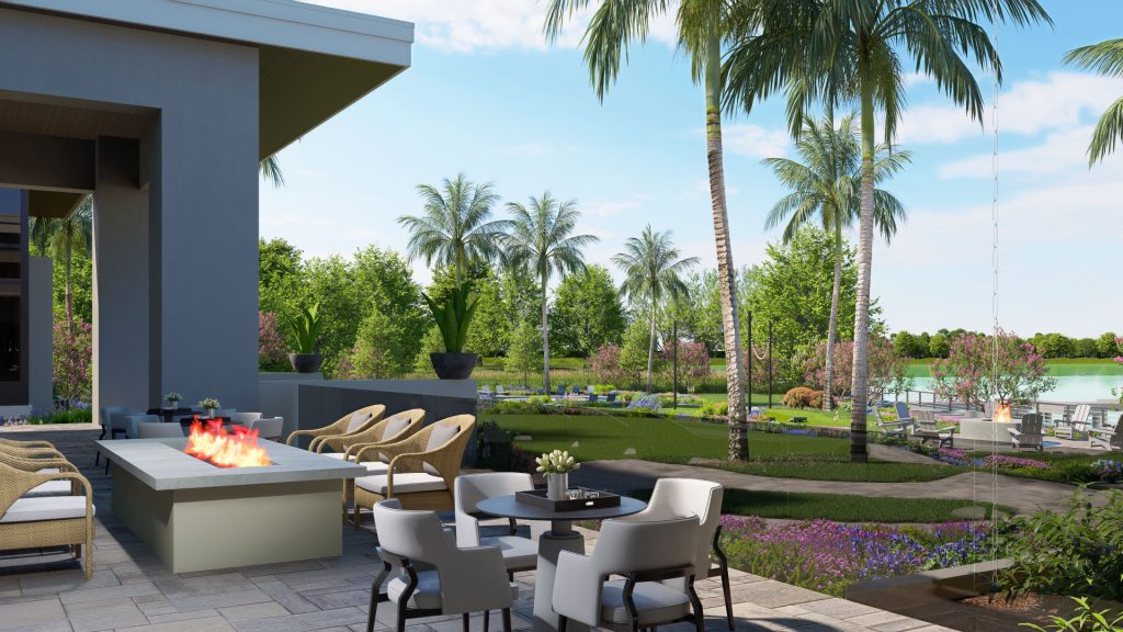 firepit at the community center overlooking the amenity campus lawn and lake