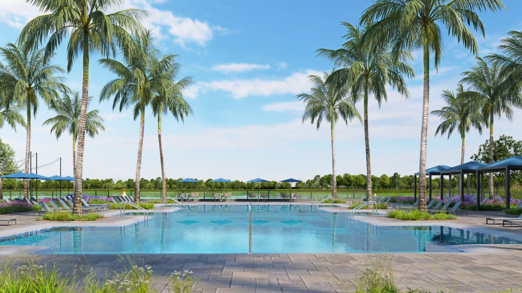pool with lounge chairs and palm trees overlooking the lake in Bonita Springs florida